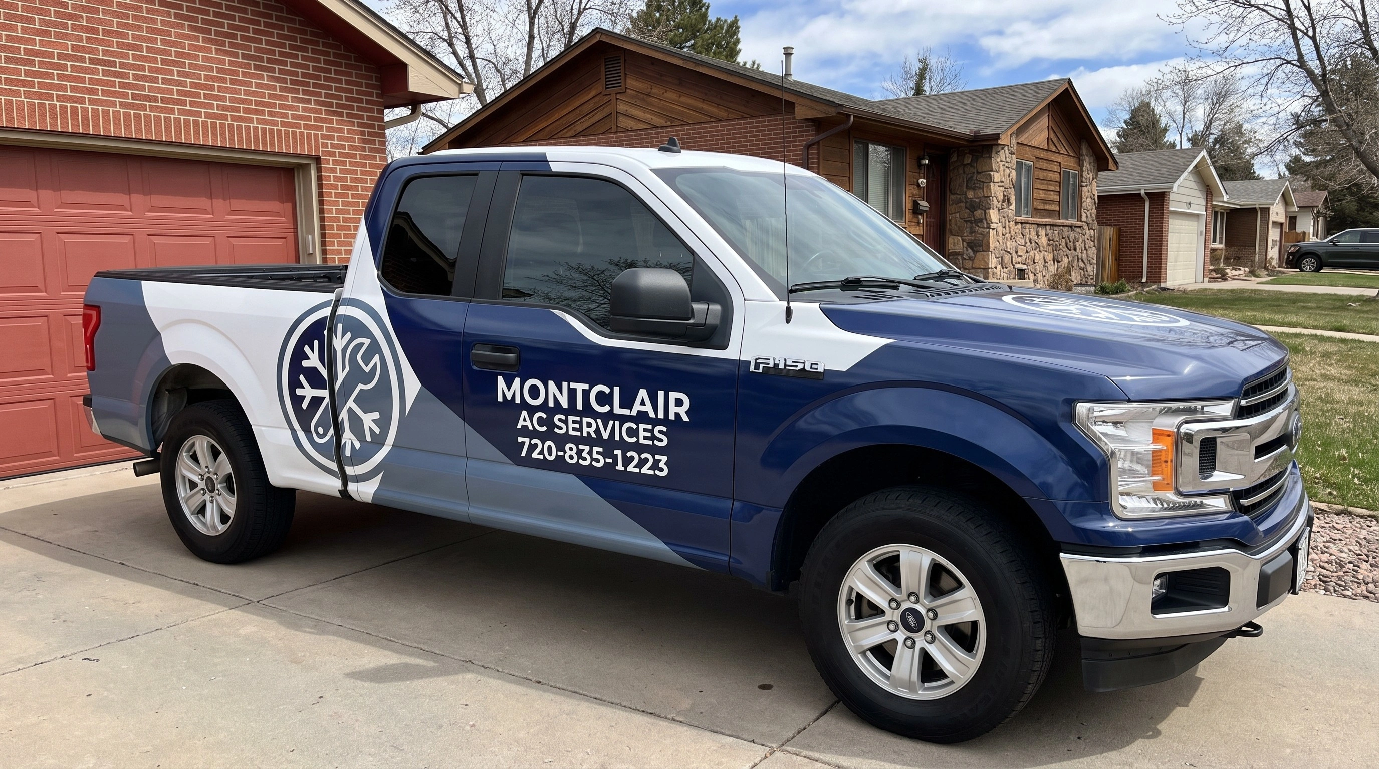 HVAC technician servicing an air conditioning unit in Denver, CO